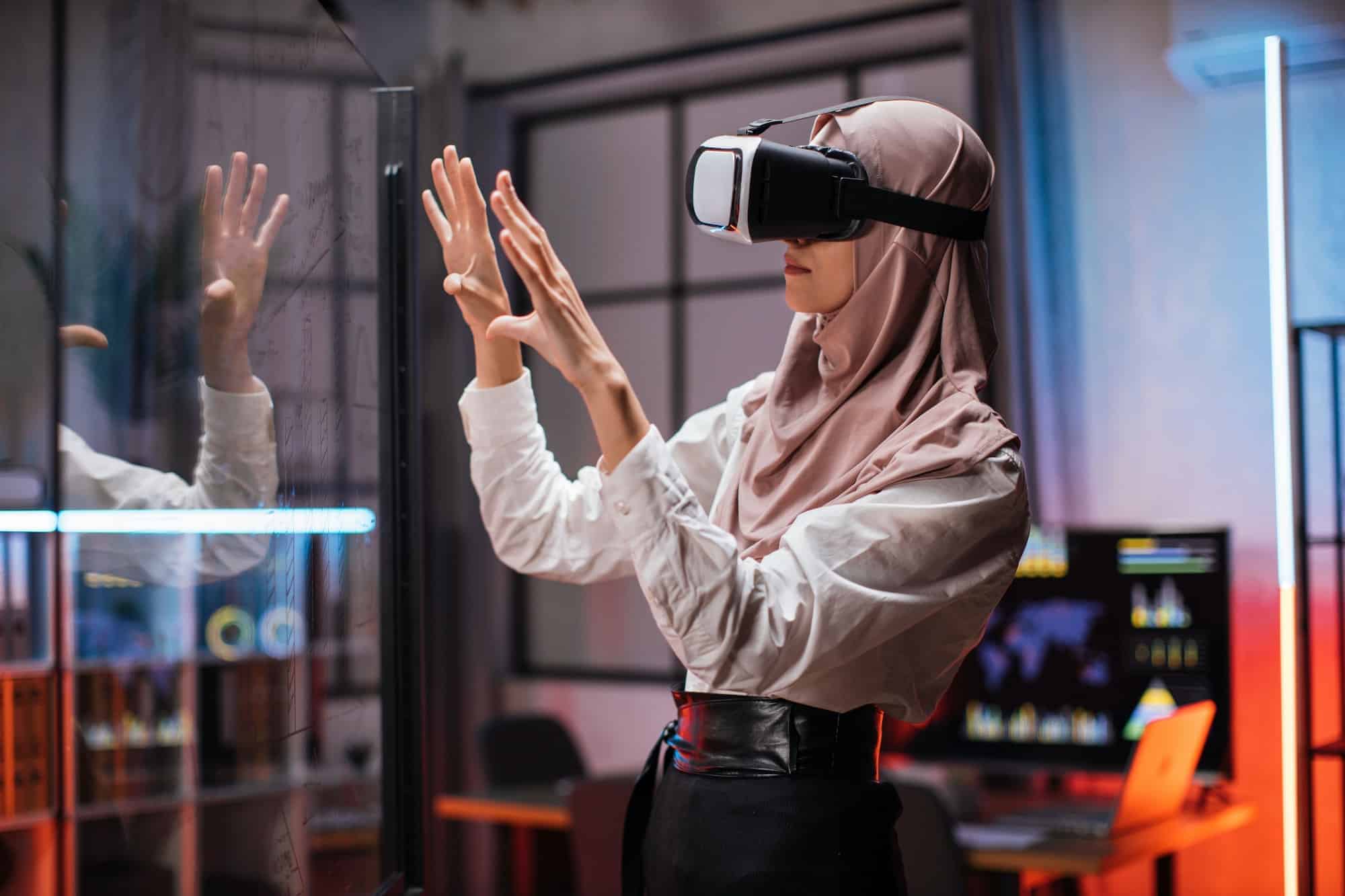 confident-muslim-woman-in-hijab-using-innovative-technology-during-business-strategy-1-1.jpg