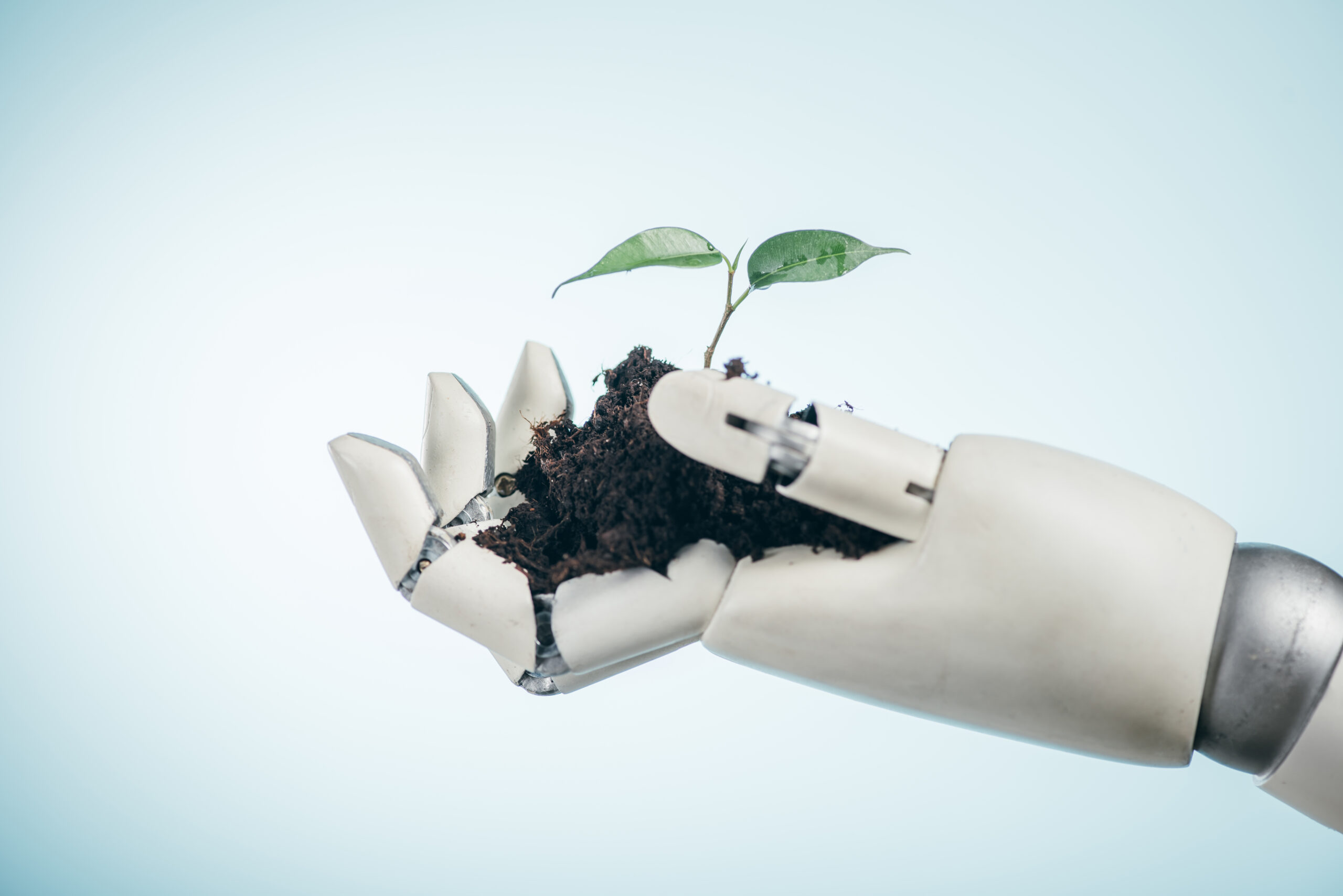 A robot is holding plant showing sustainable technological Development